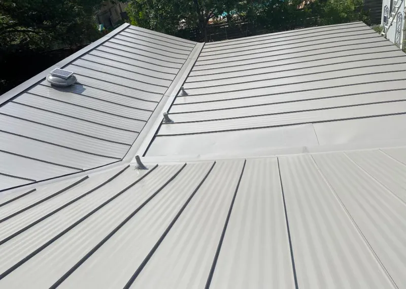 Solar attic fan installed on a metal roof for Roof Ventilation in Modesto